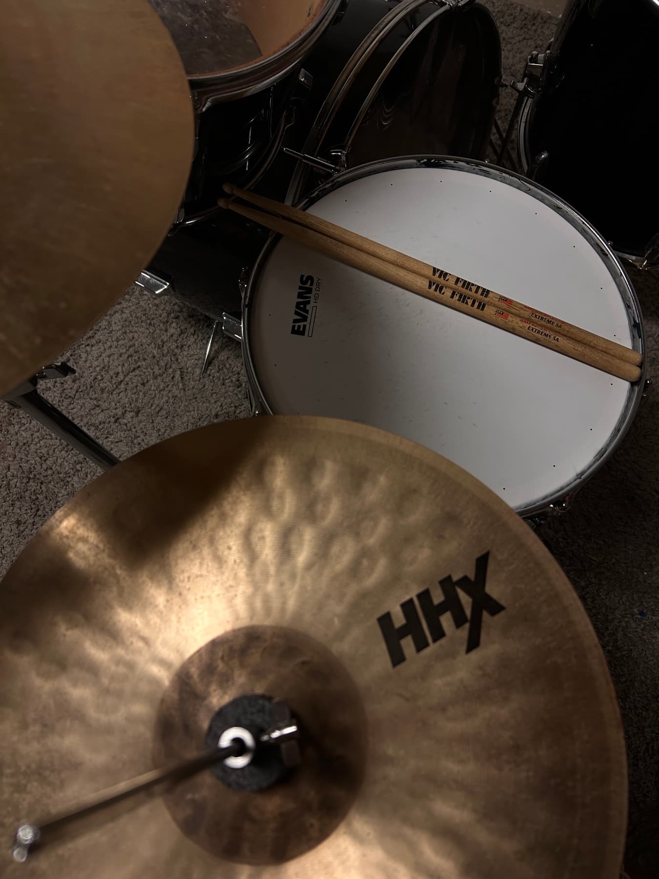 Drum kit, sticks resting on the snare